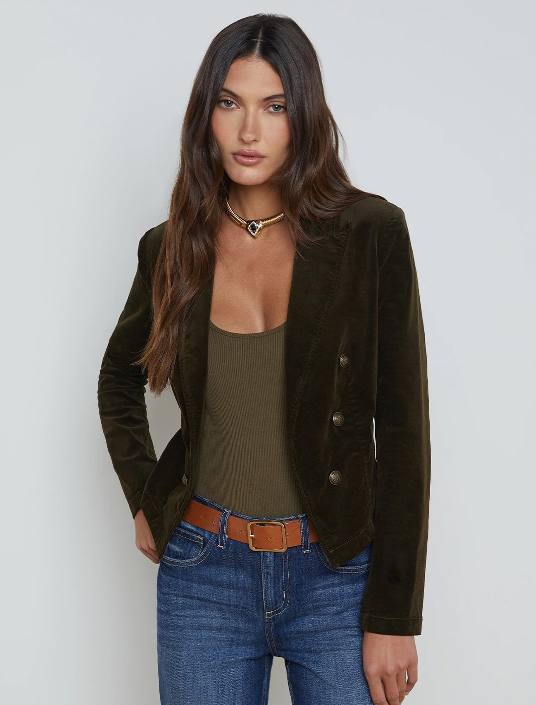 Model wearing L'Agence's wayne crop jacket in pine.