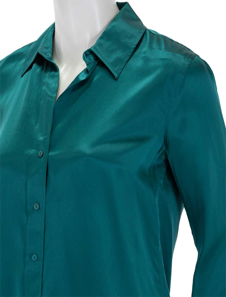 Close-up view of L'Agence's dani blouse in ocean teal.