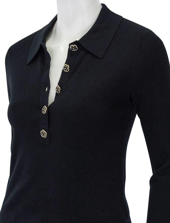 Close-up view of L'agence's sterling jewel button sweater in black.