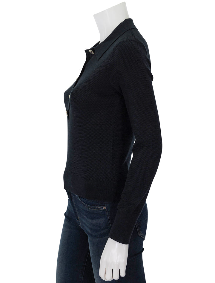 Side view of L'agence's sterling jewel button sweater in black.