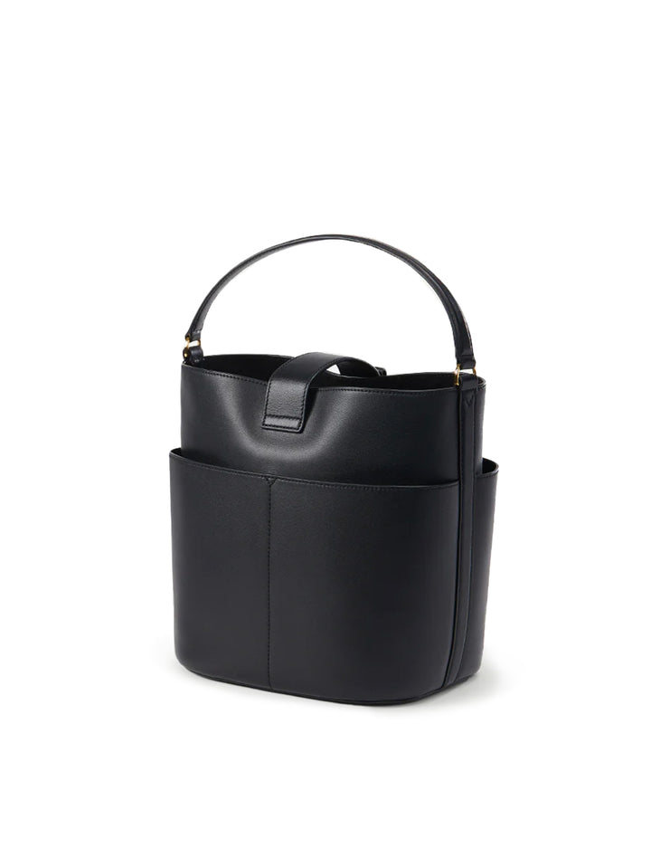 Back angle view of Veronica Beard's the small crest lock bucket bag in black.