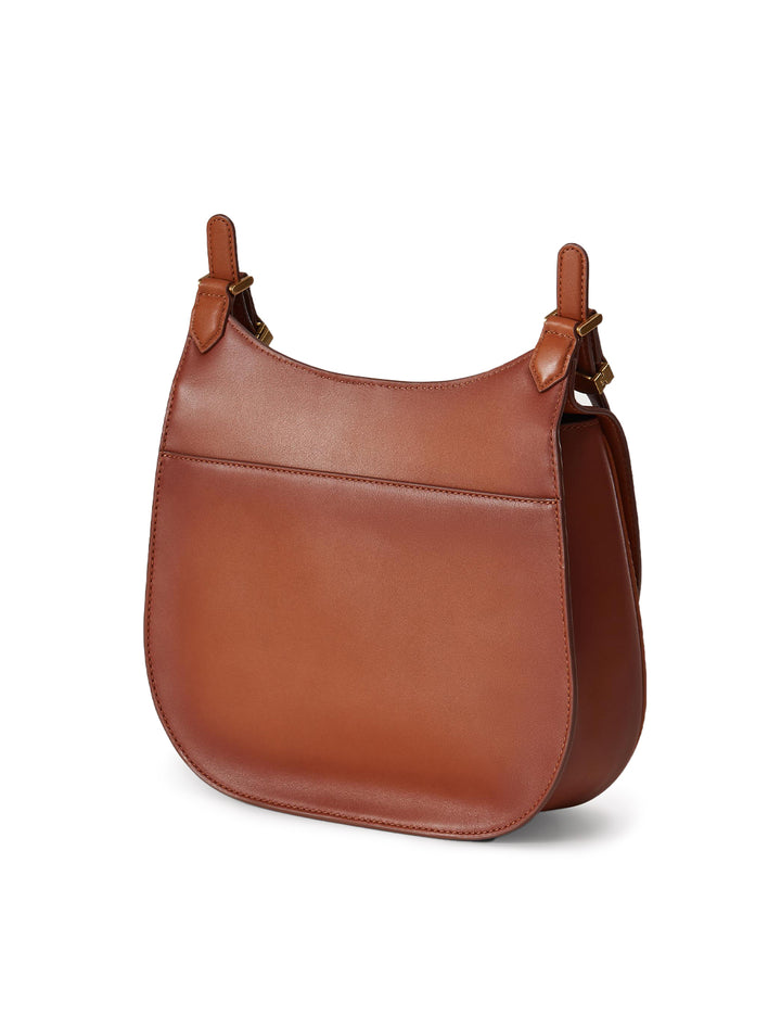 Back angle view of Veronica Beard's the crest lock messenger bag in burnished hazelwood.