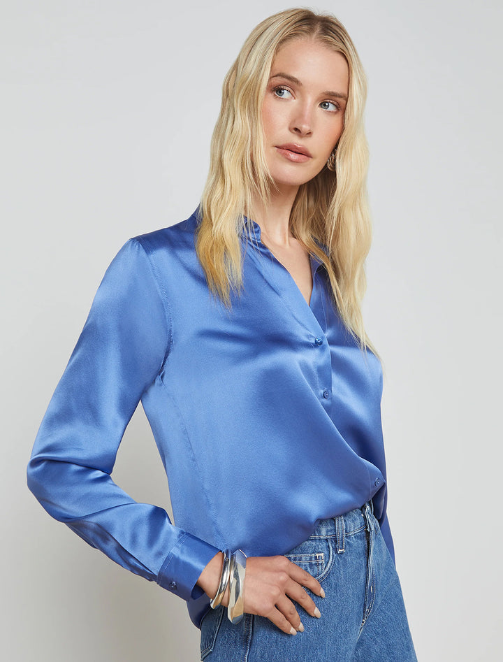 Model wearing L'agence's tyler blouse in dusty periwinkle.