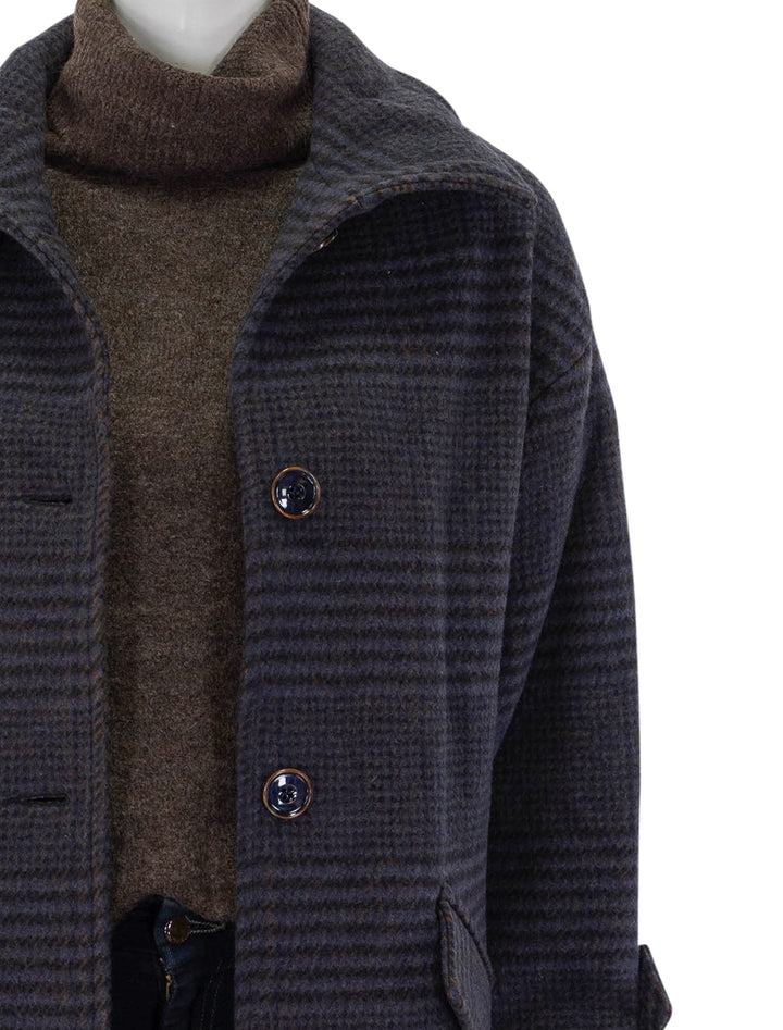 Close-up view of Sessun's miamia coat in navy and brown plaid.