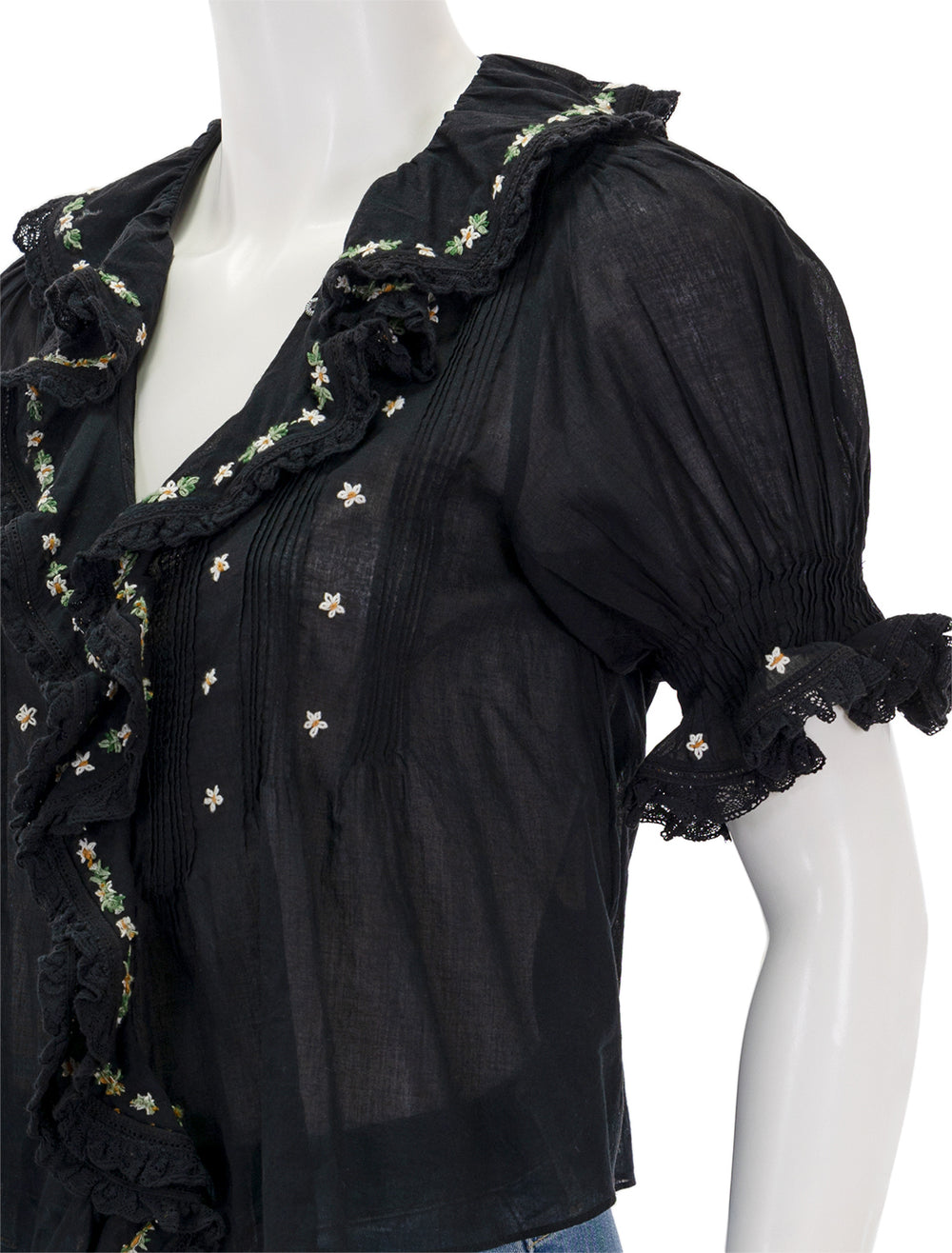 Close-up view of DOEN's hettie top with embroidery in black.