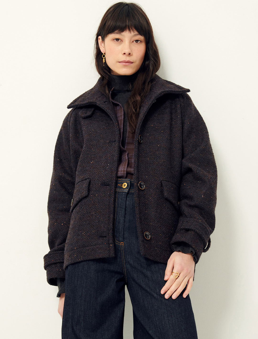 Model wearing Sessun's lee valley short coat in navy & brown fleck.