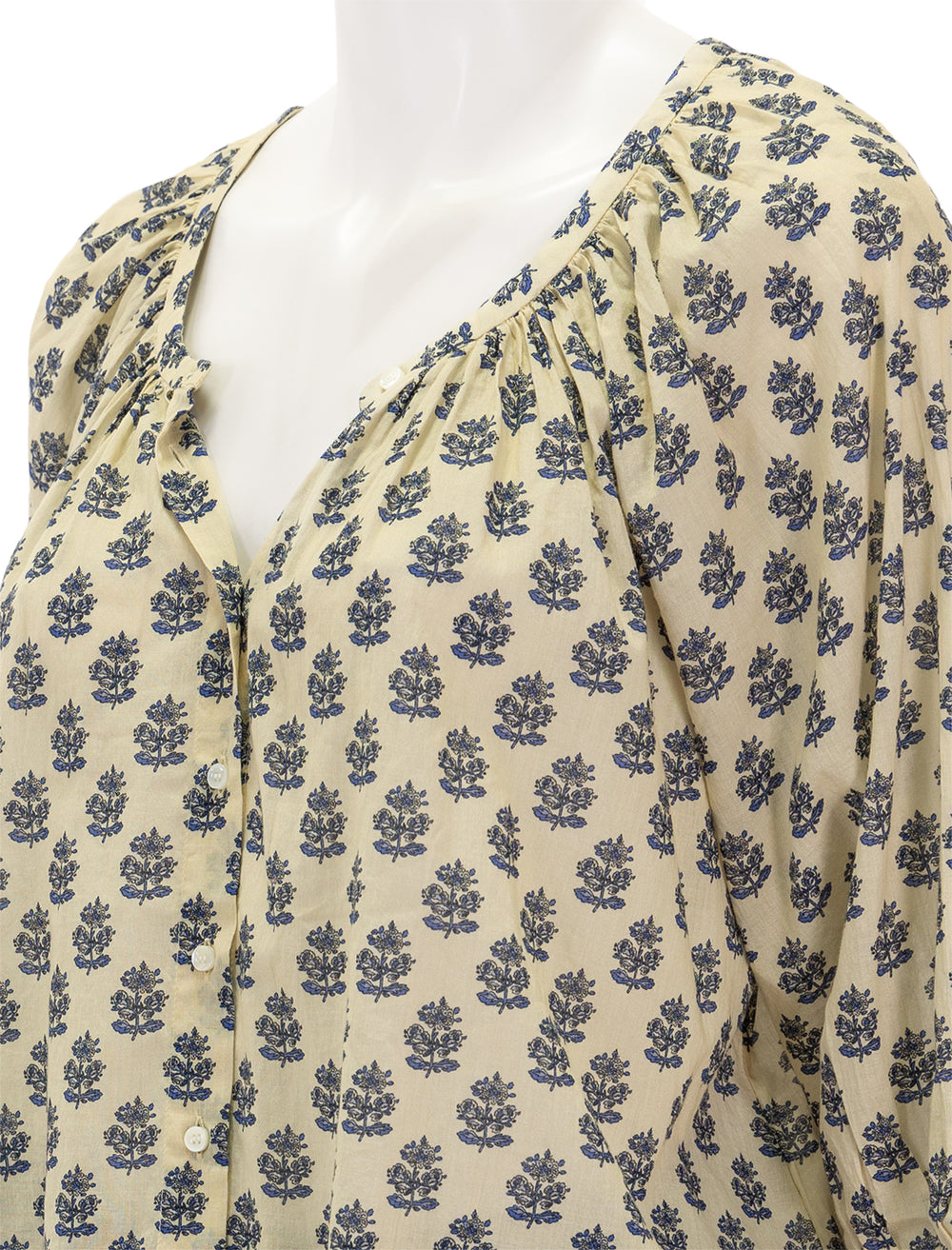 Close-up view of DOEN's jiana top meadowseet floral on voile.