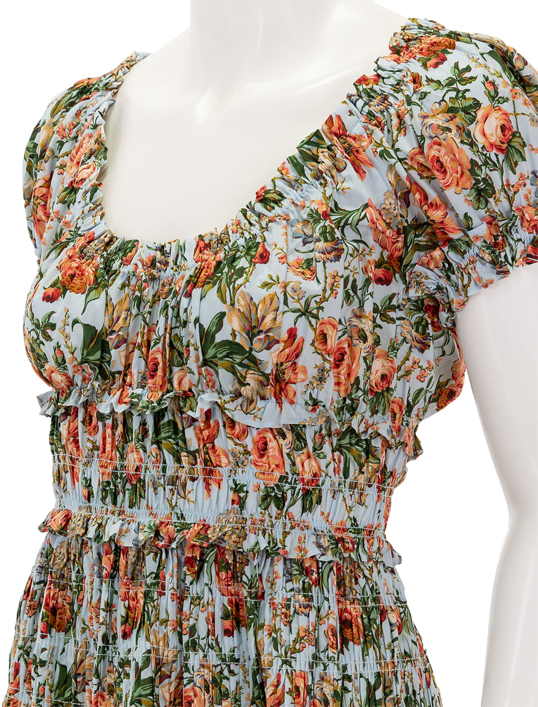 Close-up view of Doen's leanne dress in calico garden.