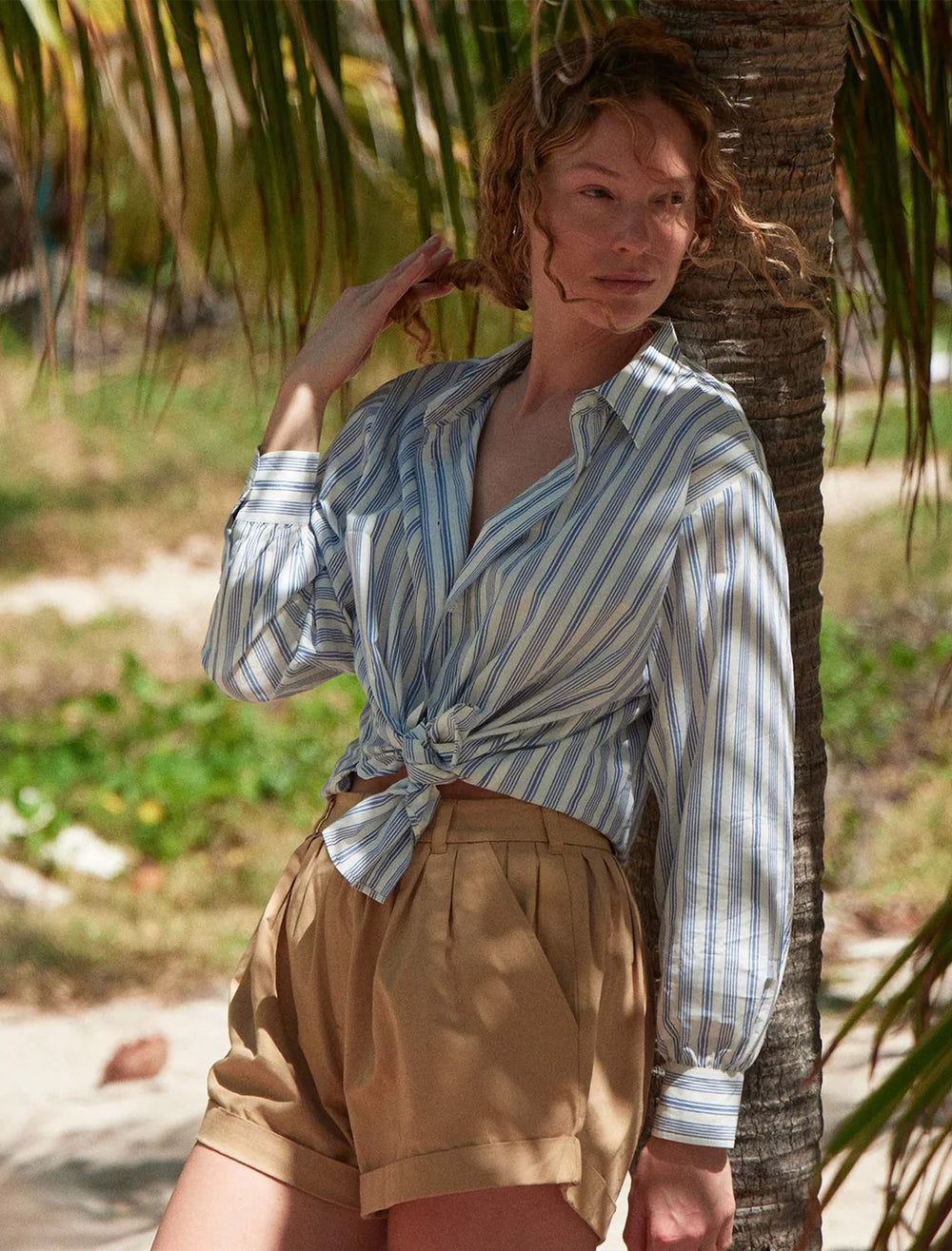 Model wearing  DOEN's hava top in indigo sorrento stripe.