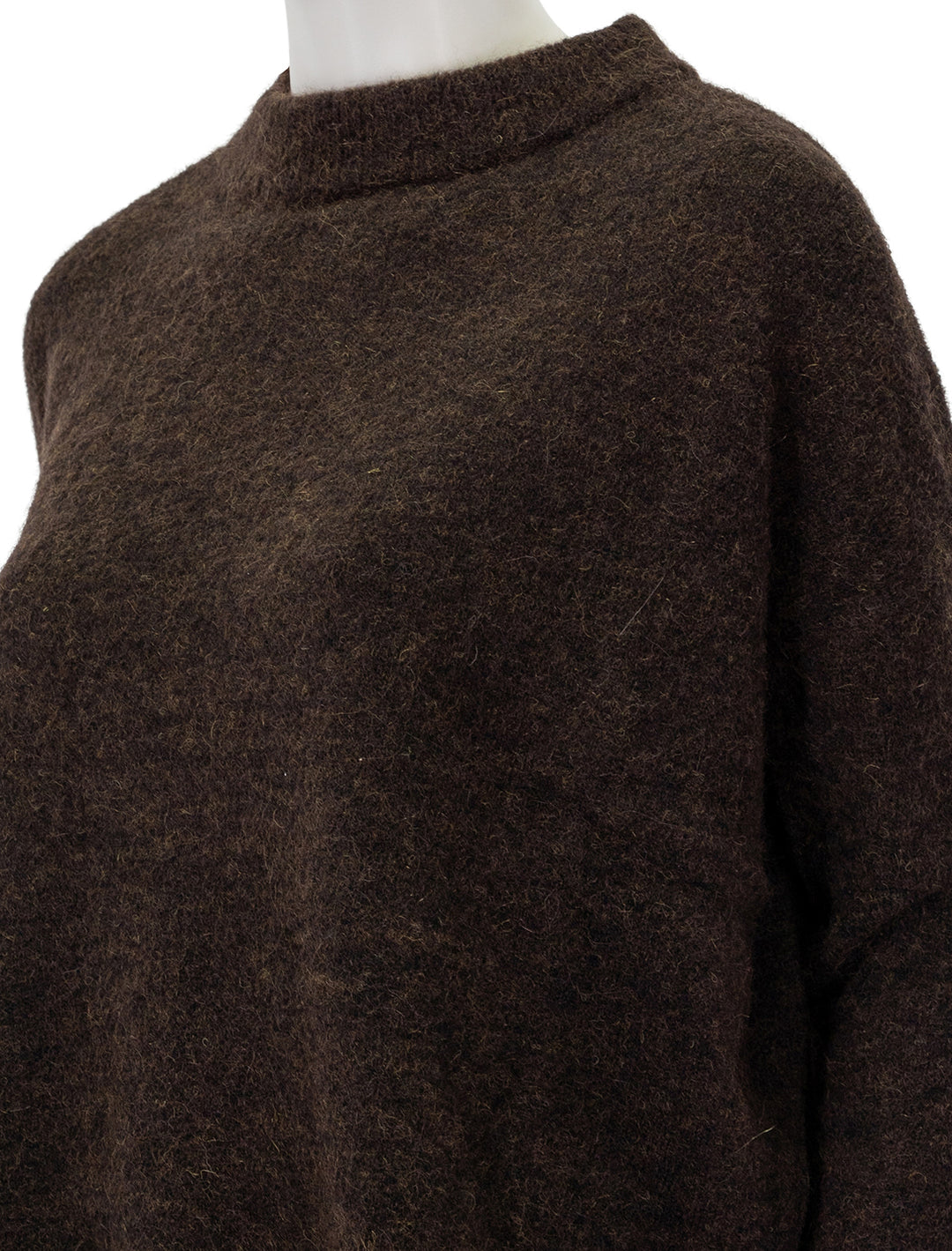 Close-up view of Sessun's kunlun pullover in wood.