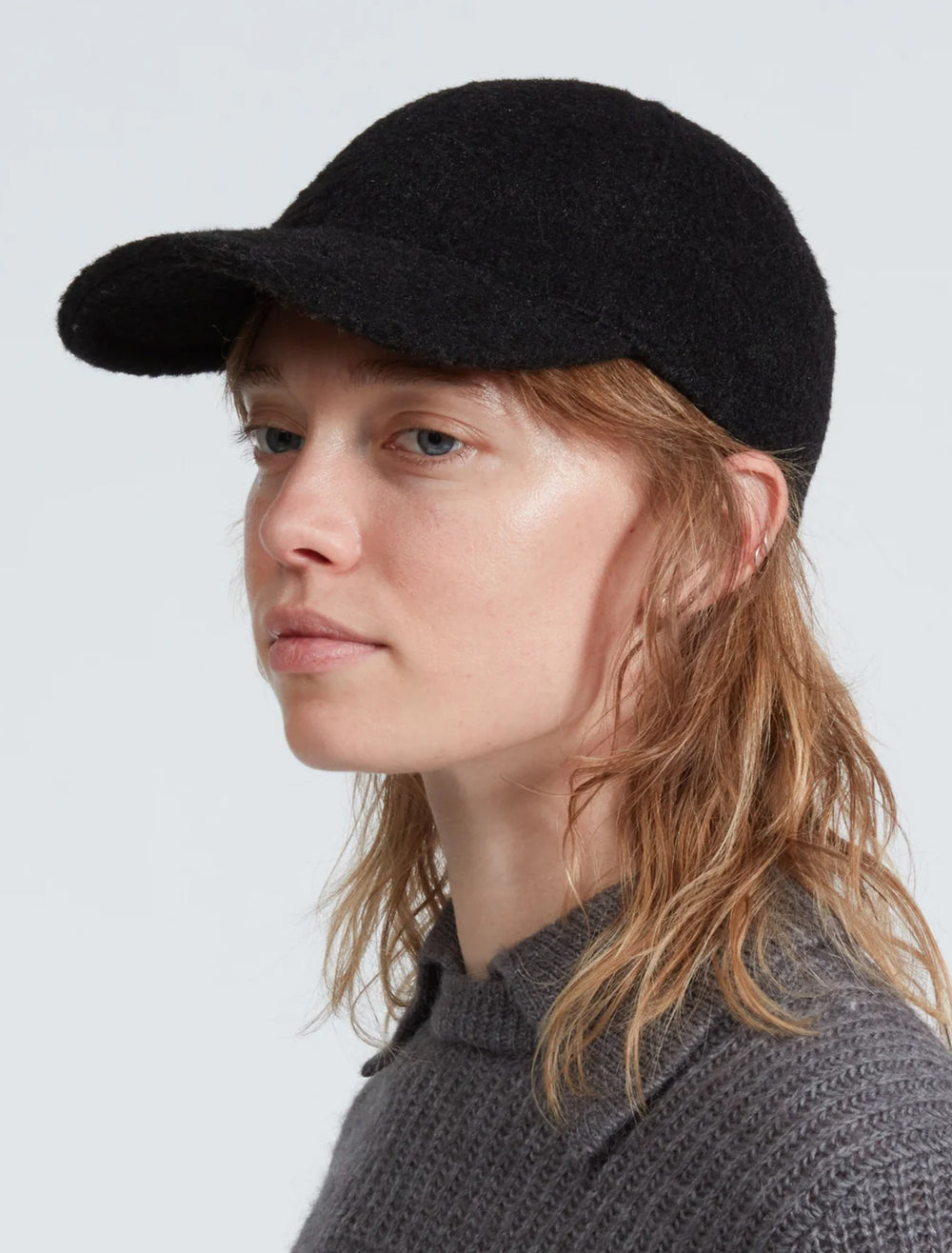 Model wearing Rag & Bone's cozy baseball hat in black.