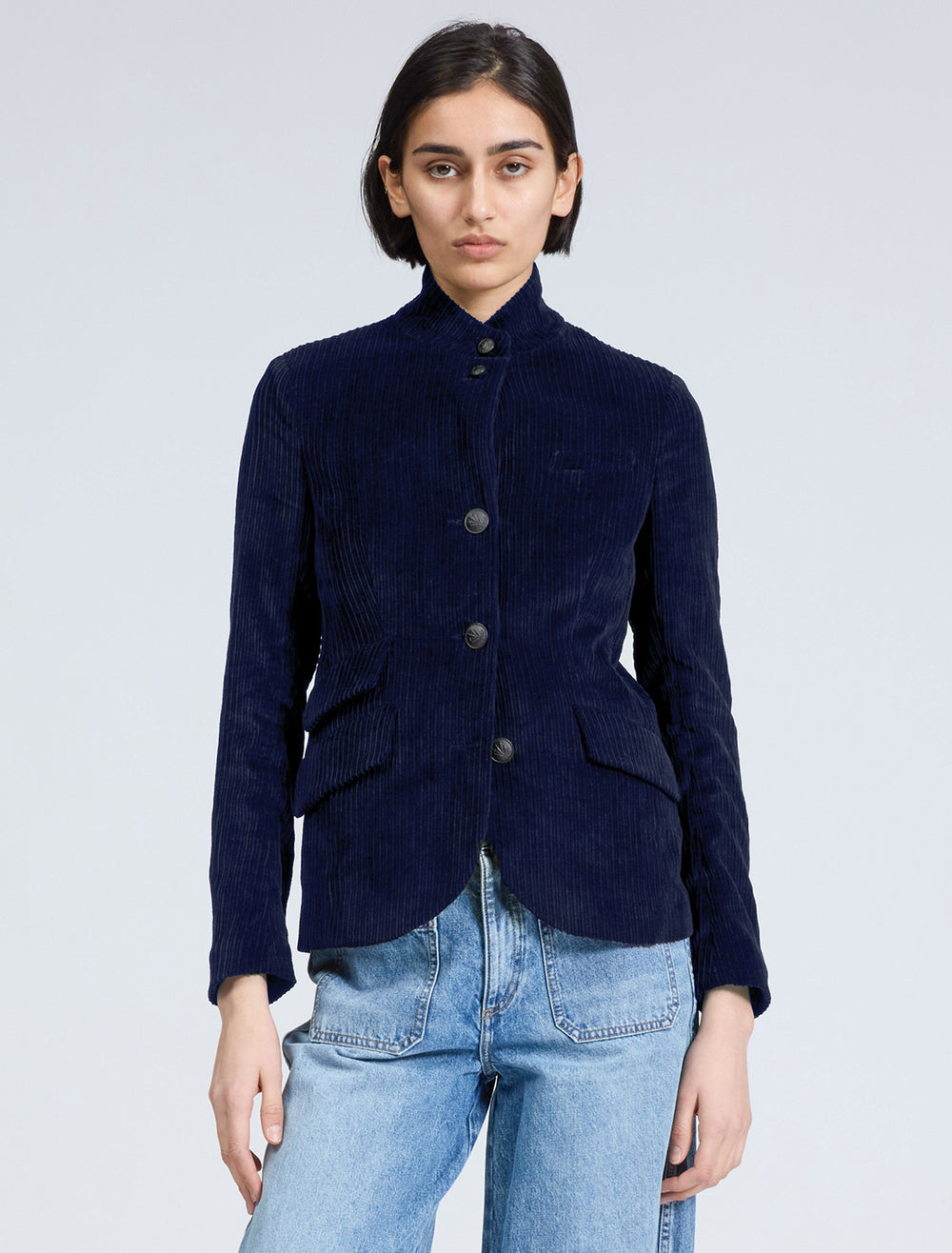 Model wearing  Rag & Bone's slade cord blazer in navy.