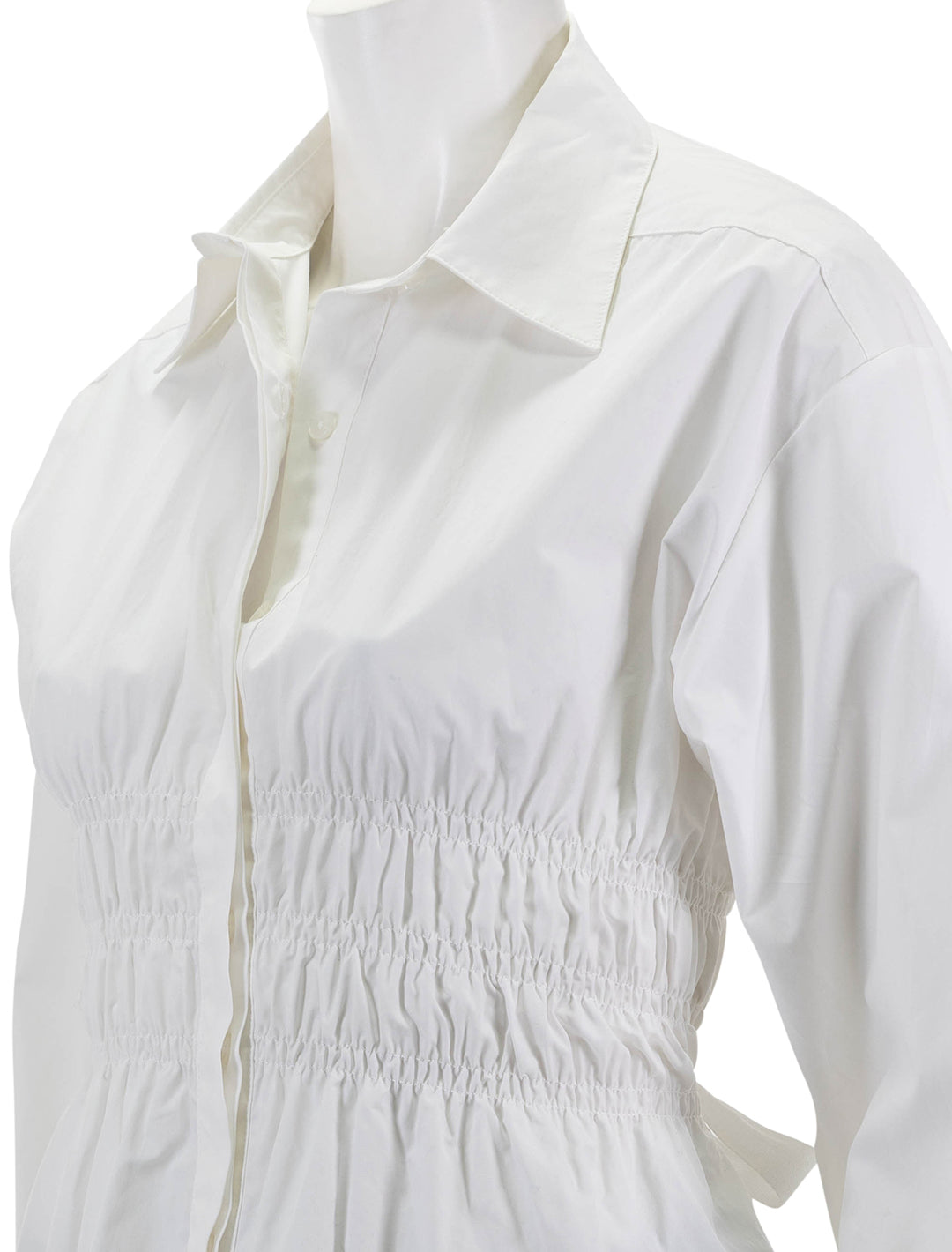 Close-up view of Saint Art's yvonne ruched front-tie blouse in white.