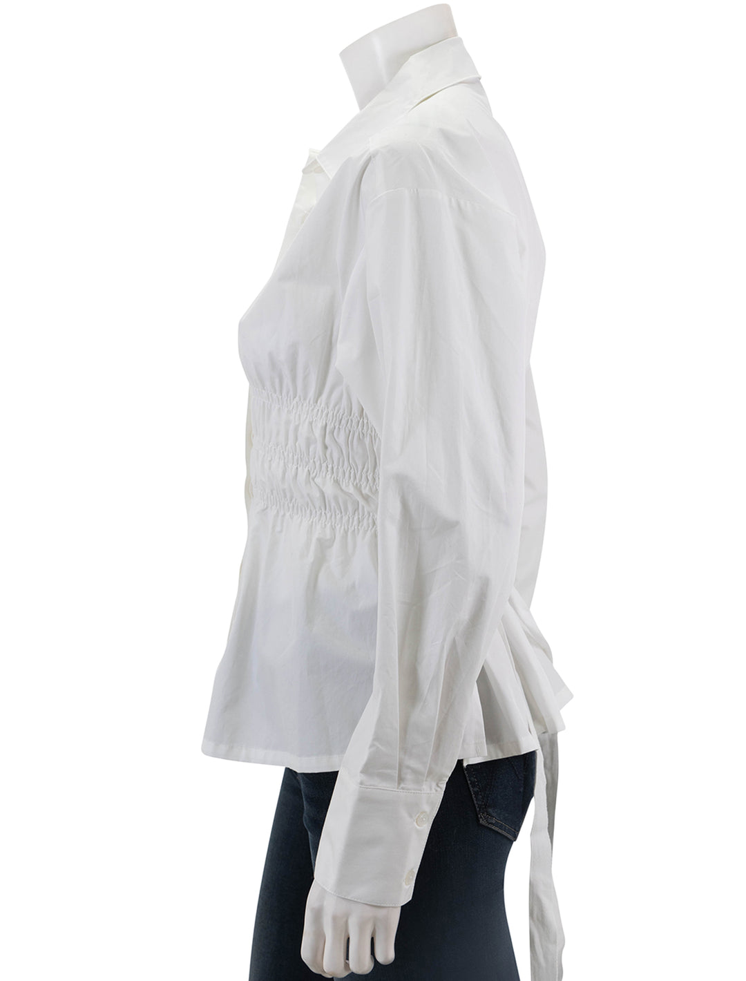 Side view of Saint Art's yvonne ruched front-tie blouse in white.