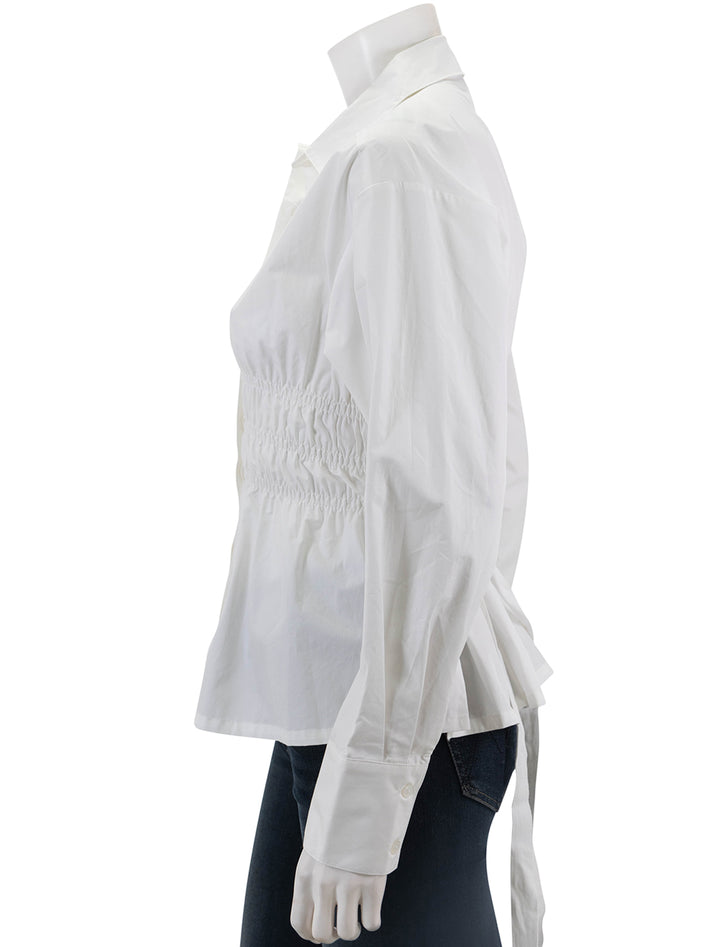 Side view of Saint Art's yvonne ruched front-tie blouse in white.