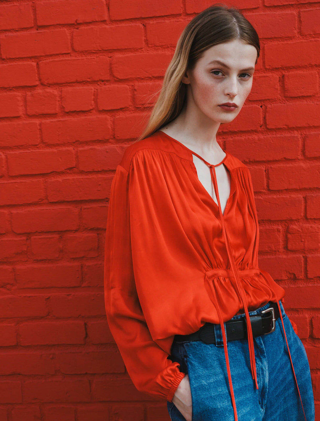 Model wearing Saint Art's arya blouse in molten lava.