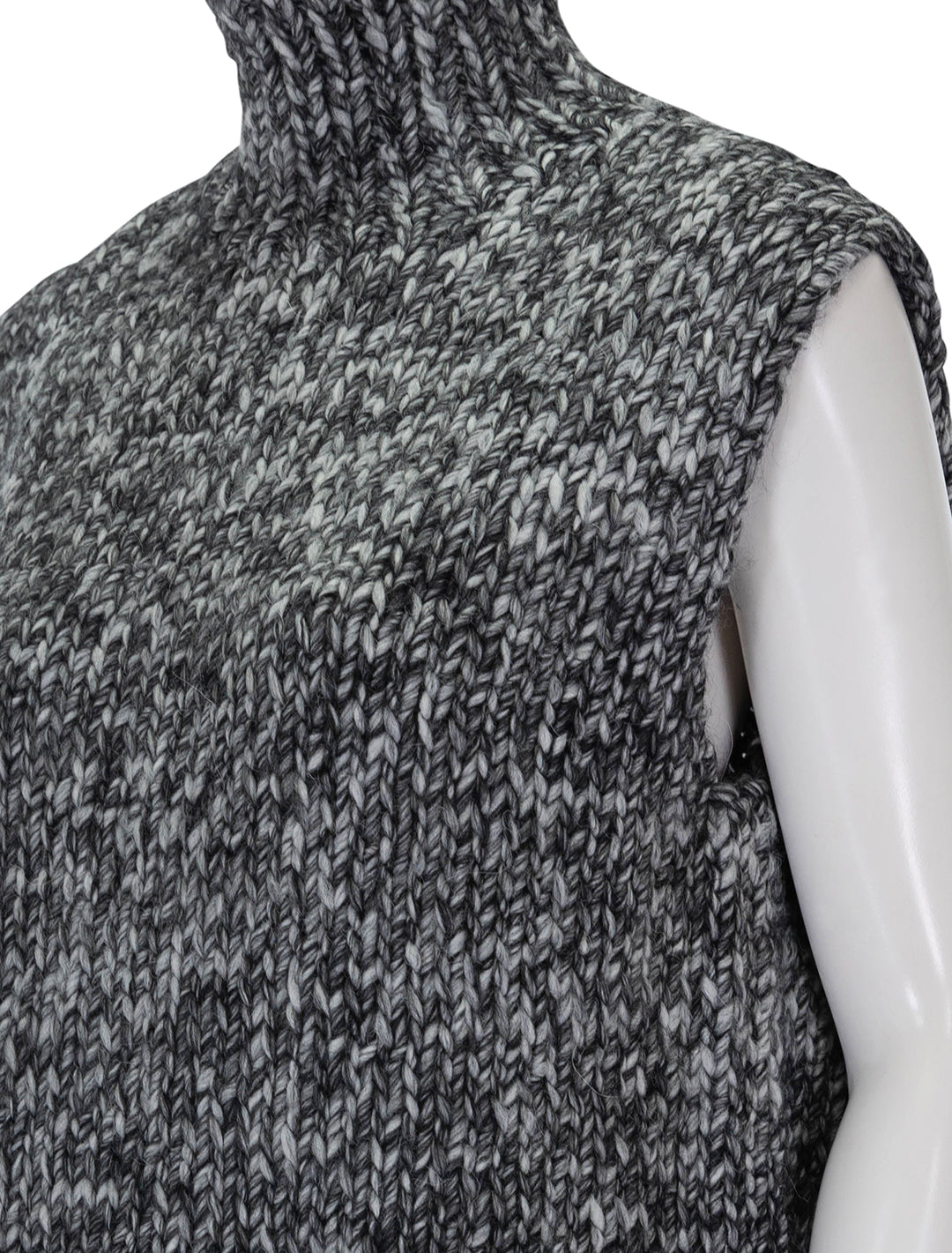 Close-up view of Line's reign sleeveless sweater in evening sky.