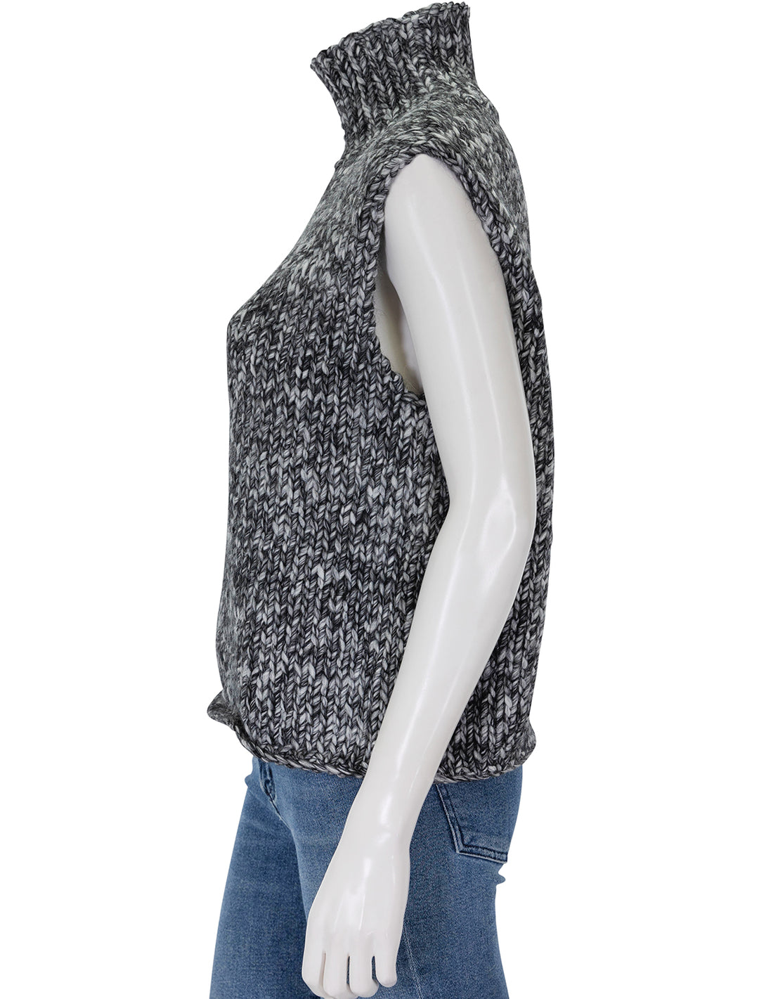 Side view of Line's reign sleeveless sweater in evening sky.