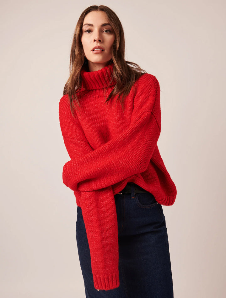 Model wearing Line's amelie turtleneck in scarlet.