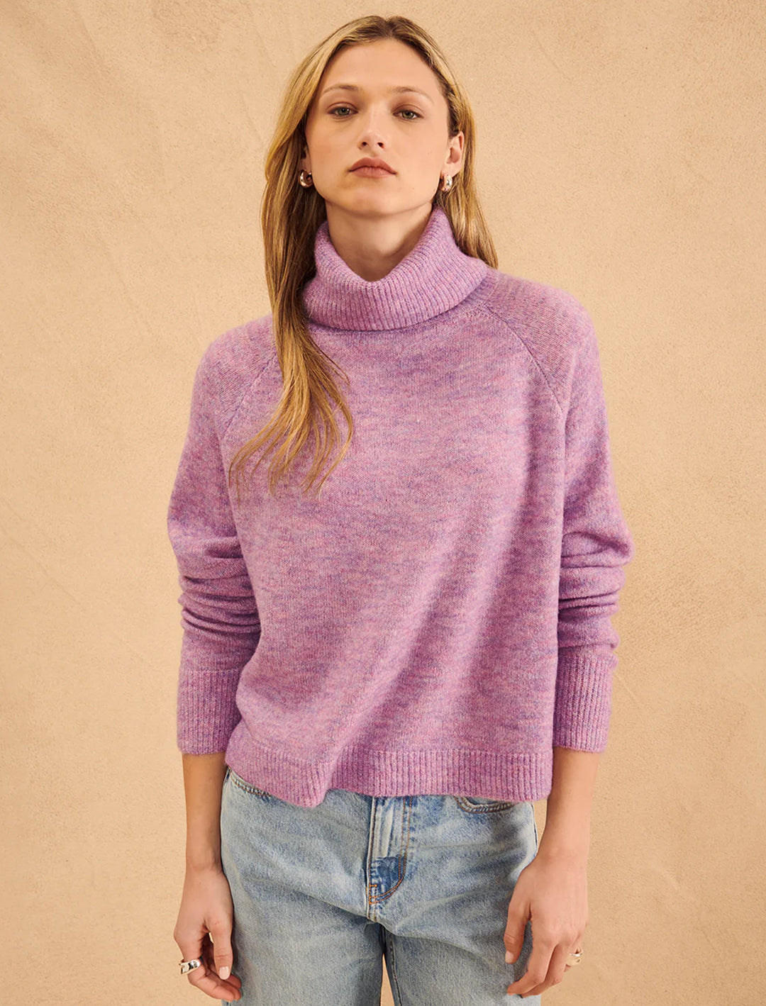 Model wearing John + Jenn's emmett turtleneck in candy floss.