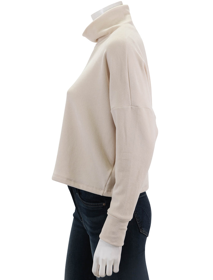 Side view of Stateside's Honeyluxe Flatback Rib Dolman Top in Cream.