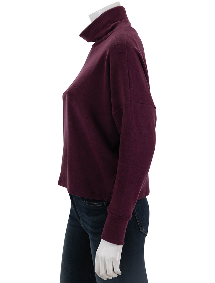 Side view of Stateside's Honeyluxe Flatback Rib Dolman Top in Cherry Liquor.