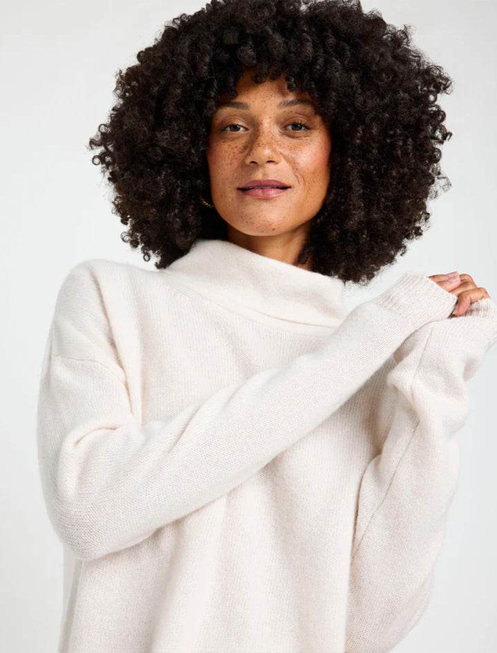 Model wearing Splendid's tori cashmere cowl neck sweater in pale oak heather.