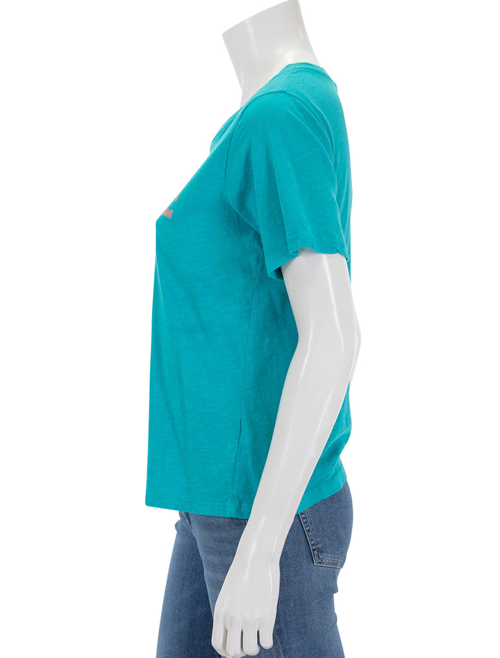 Side view of Sundry's venice beach rolled sleeve tee in intense teal.