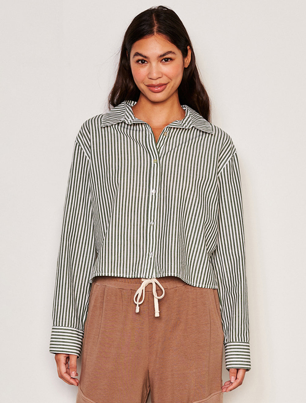 Model wearing Sundry's cropped classic shirt in fern stripe.