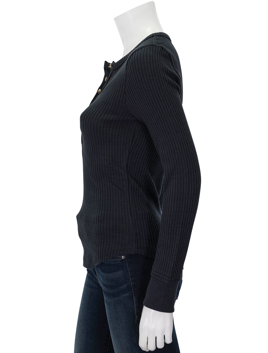 Side view of Faherty's legend apres waffle henley in heather black.