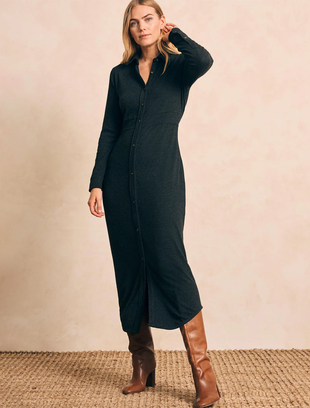 Model wearing Faherty's legend sweater maxi dress in heathered black twill.