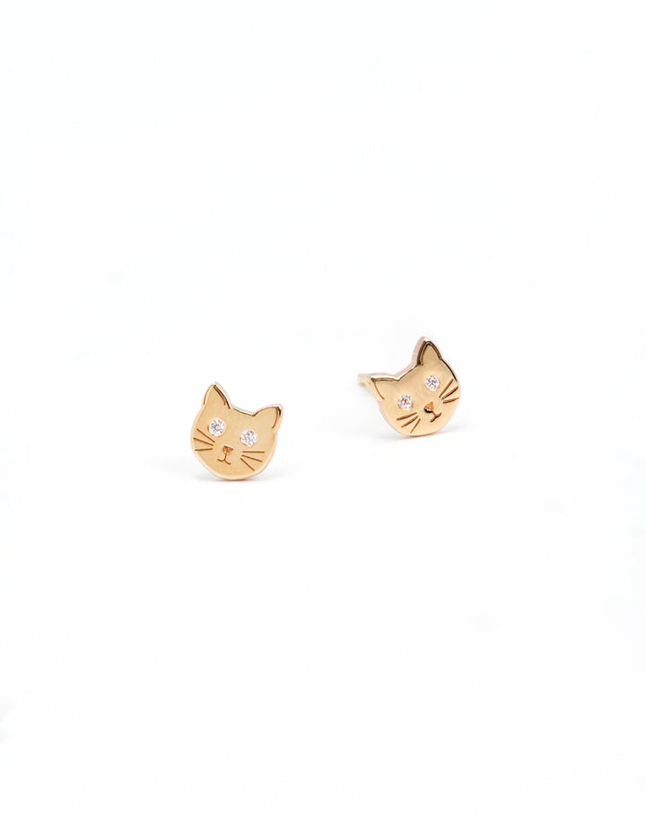 Close-up view of Zoe Chicco's 14k itty bitty kitty studs with diamonds.