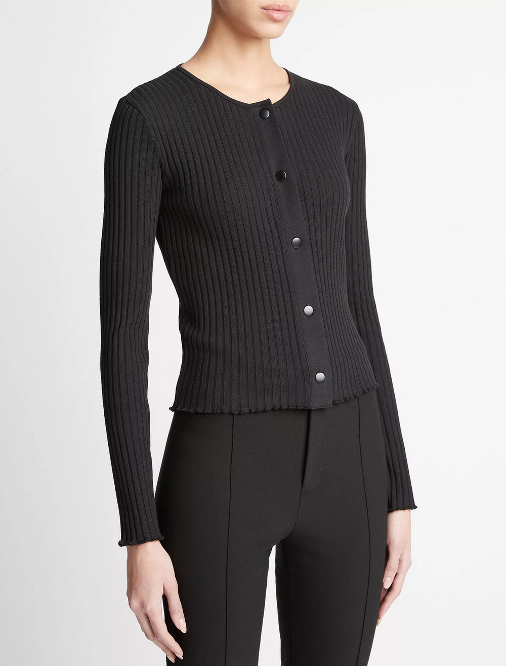 Model wearing Vince's ribbed cardigan in black.