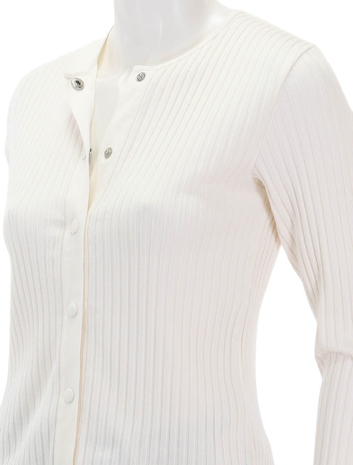 Close-up view of Vince's ribbed cardigan in off white.