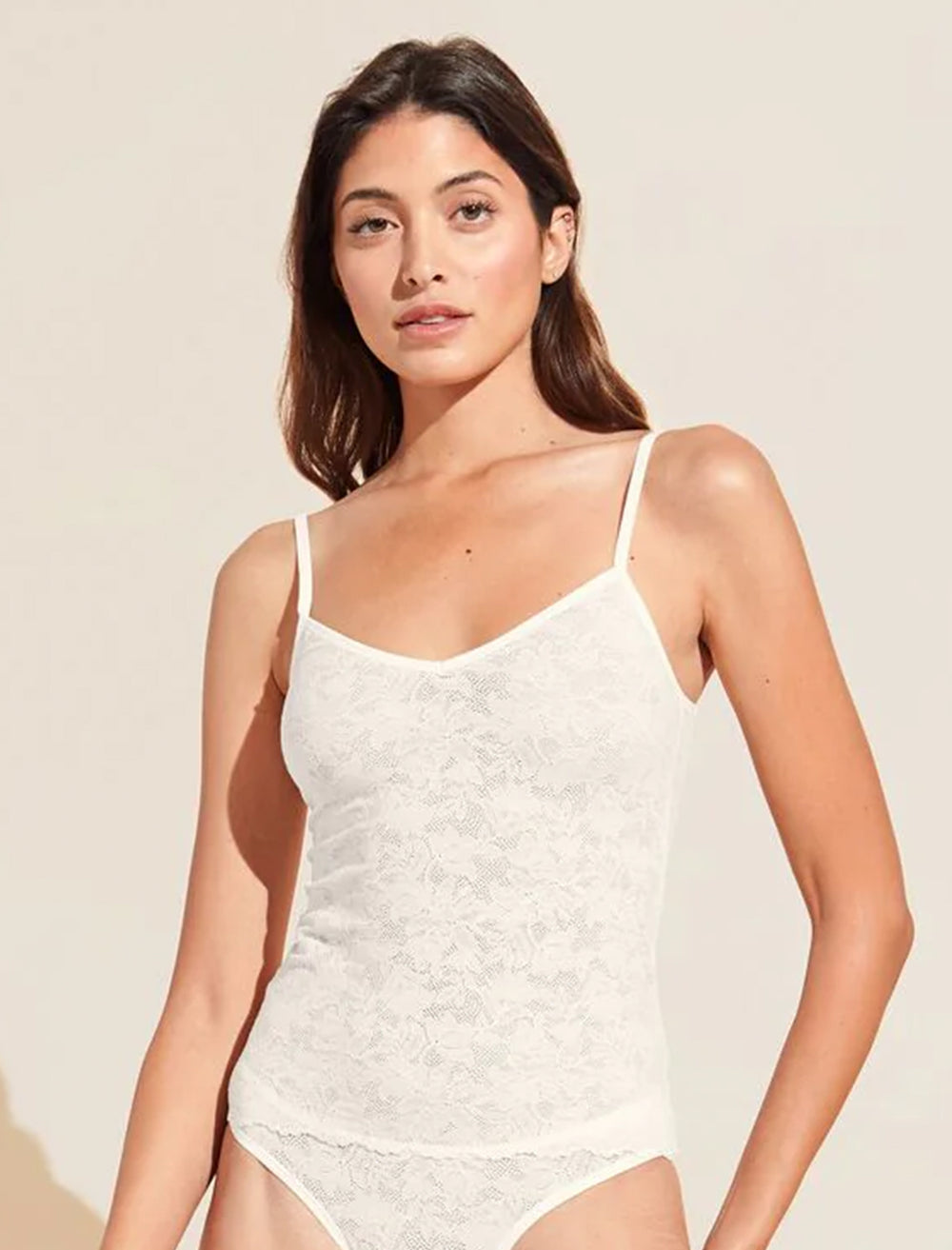 Model wearing Eberjey's soft stretch recycled lace cami in ivory.