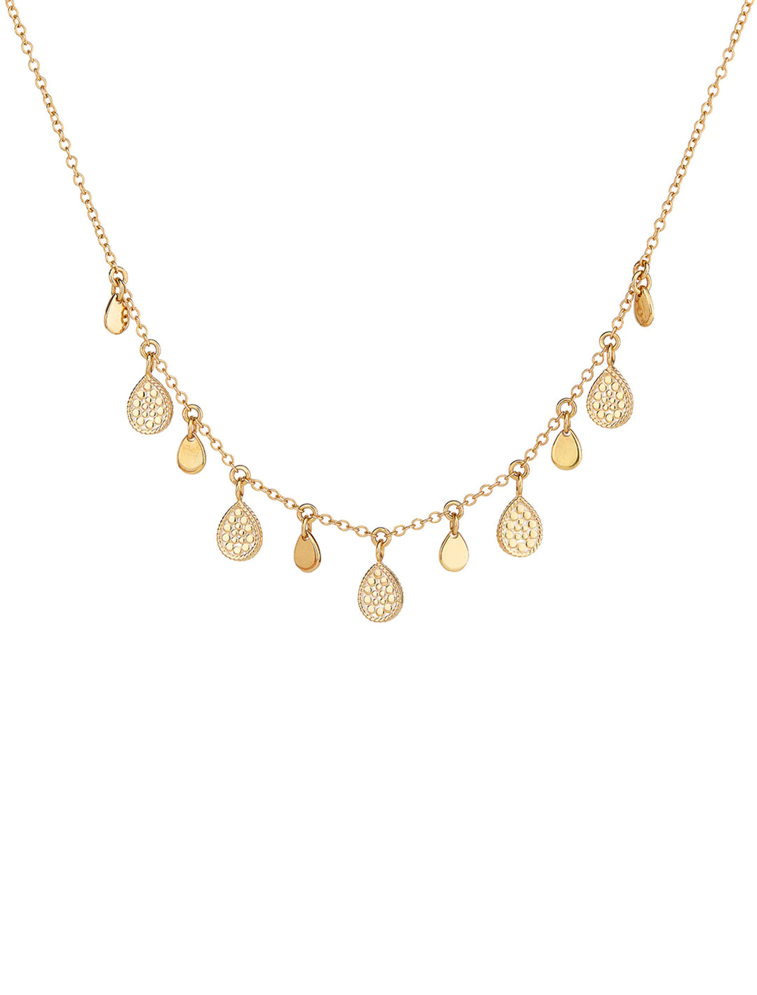 Front view of Anna Beck's teardrop charm necklace in gold.