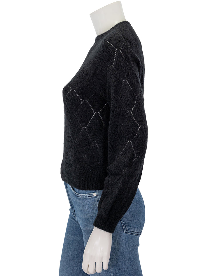 Side view of Lilla P.'s easy pointelle crewneck sweater in black.