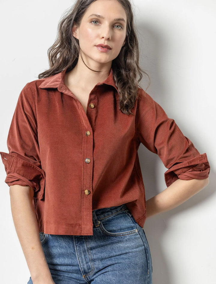 Model wearing Lilla P.'s corduroy button down shirt in brandy.