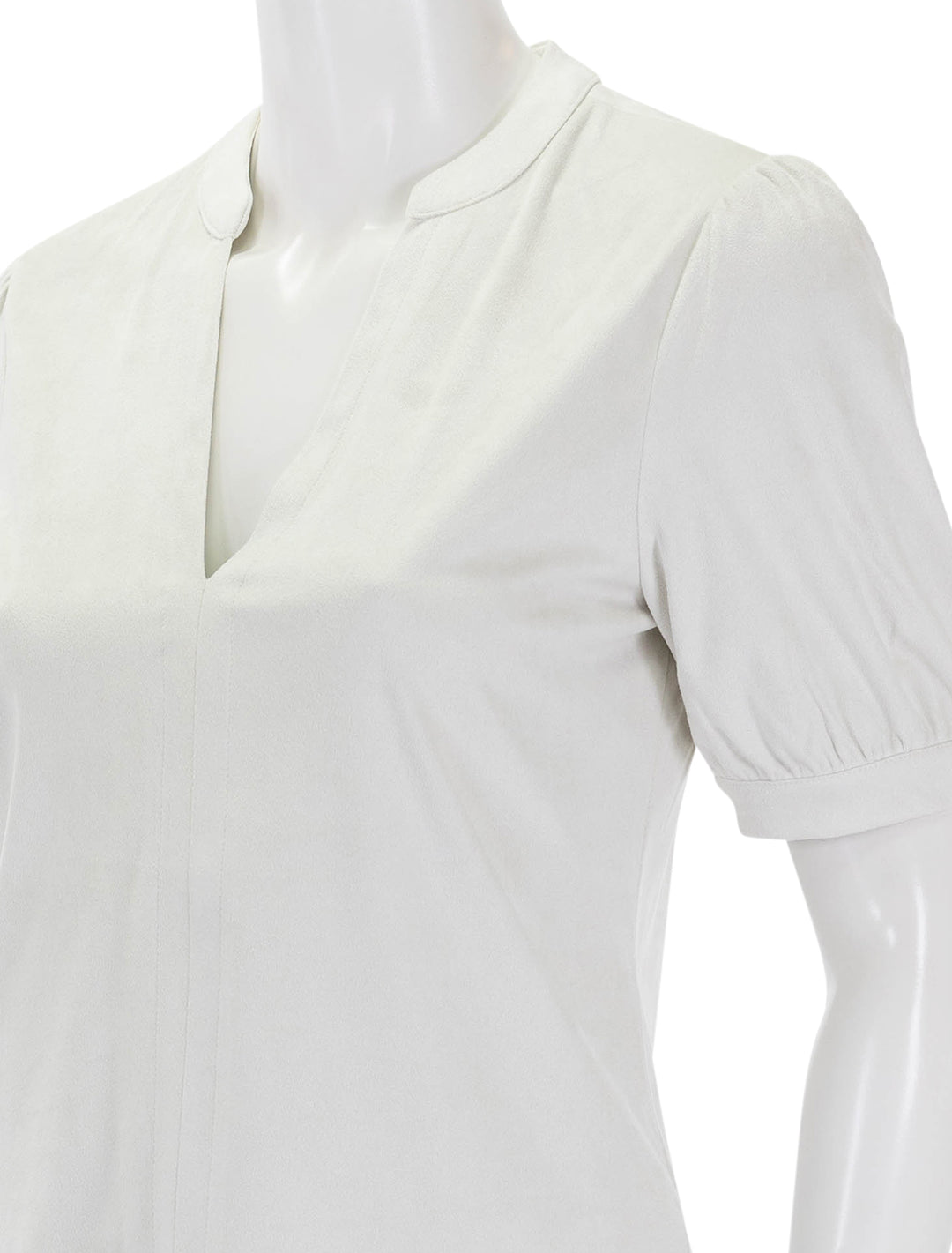 Close-up view of Steve Madden's jane top in off white faux suede.