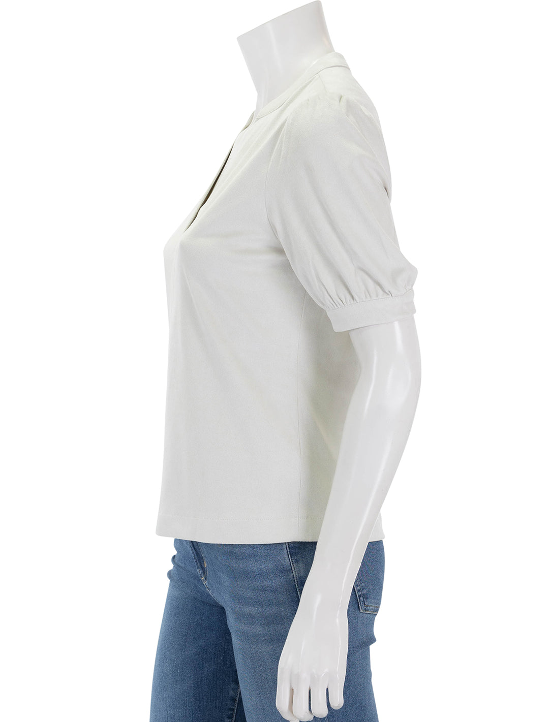 Side view of Steve Madden's jane top in off white faux suede.