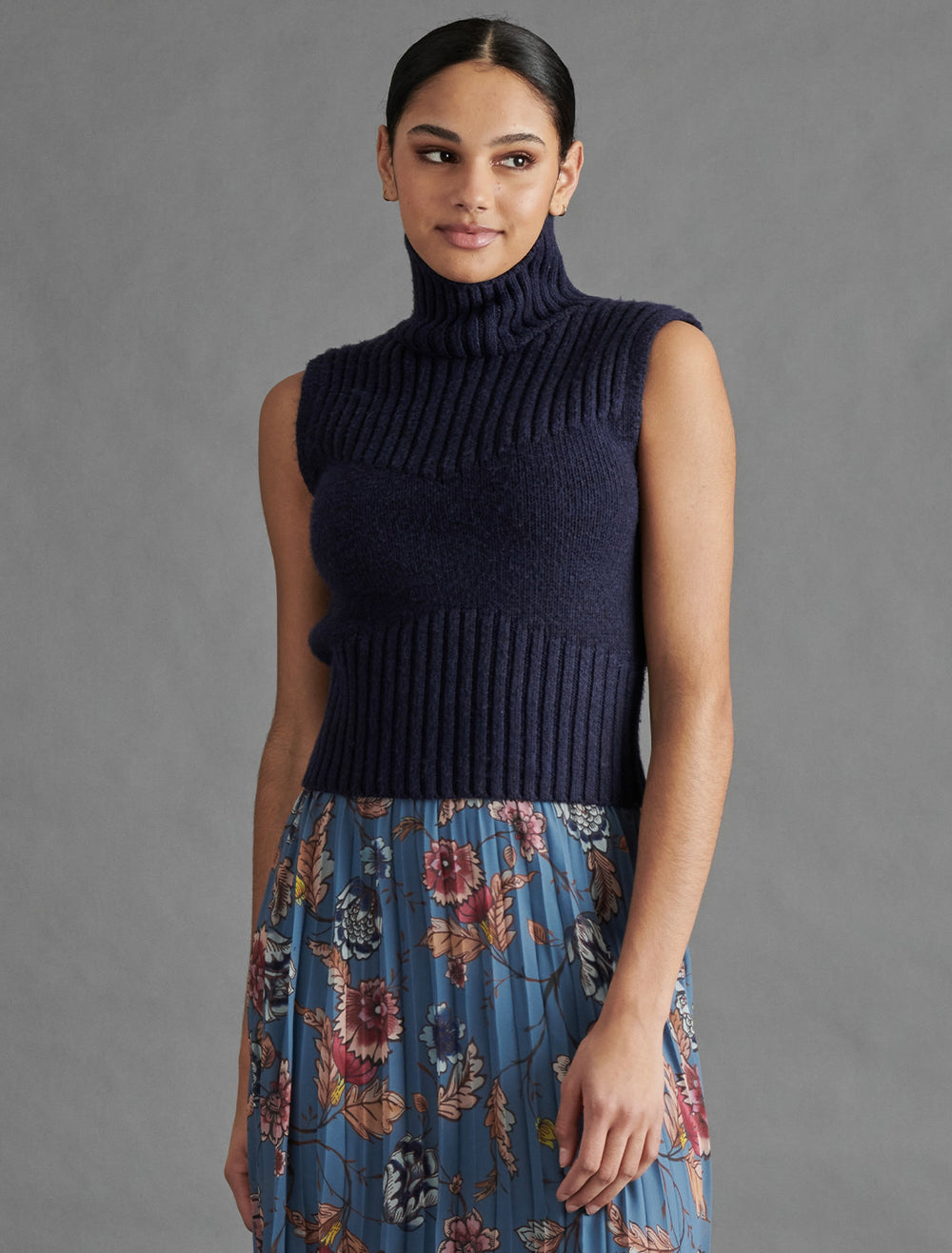 Model wearing Steve Madden's serin sweater in midnight.