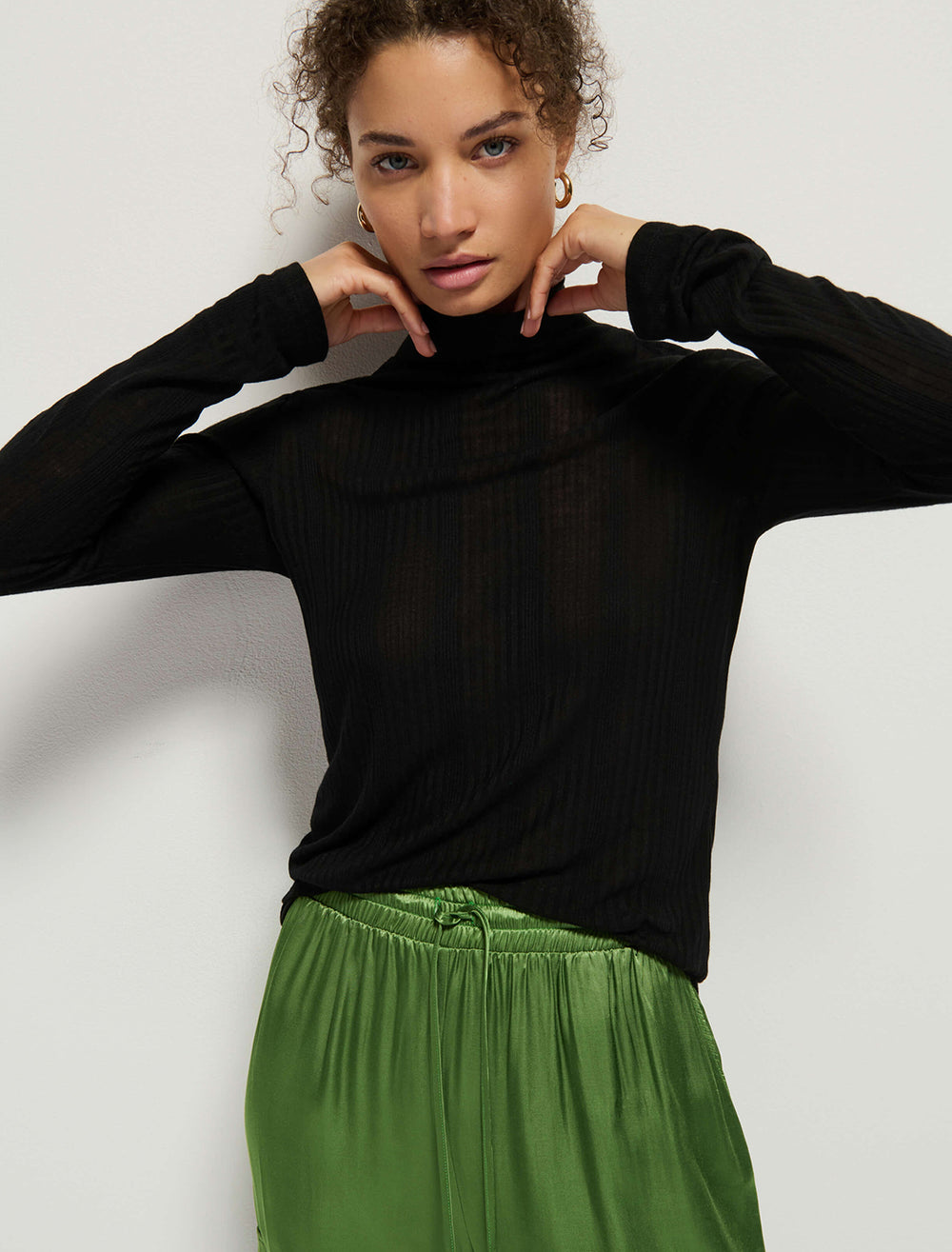 Model wearing Nation LTD.'s rene turtleneck in jet black.