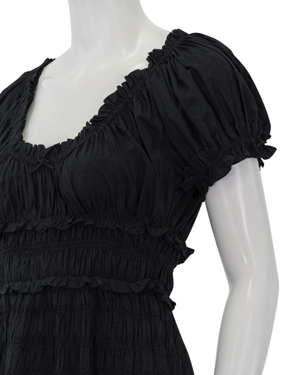 Close-up view of DOEN's leanne dress in black.