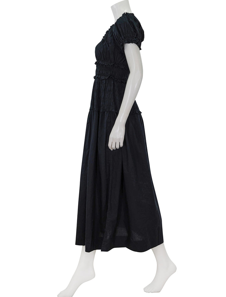 Side view of DOEN's leanne dress in black.