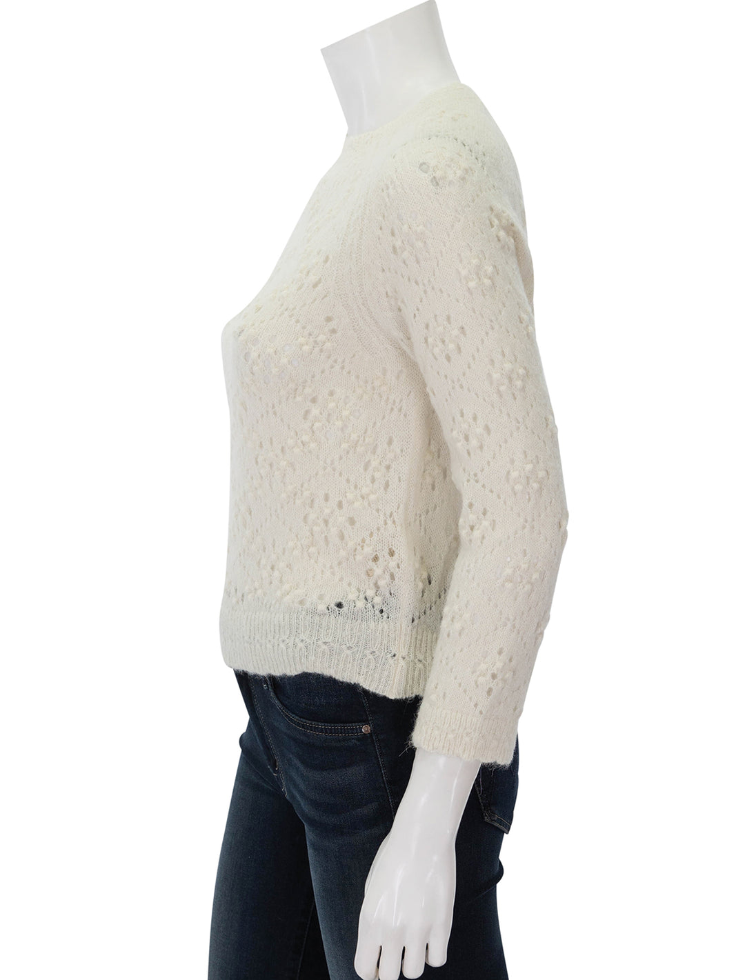 Side view of Doen's emiliana sweater in ivory.