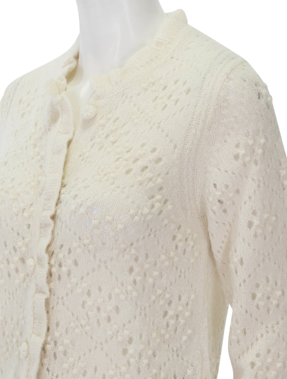 Close-up view of Doen's claudie cardigan in ivory.