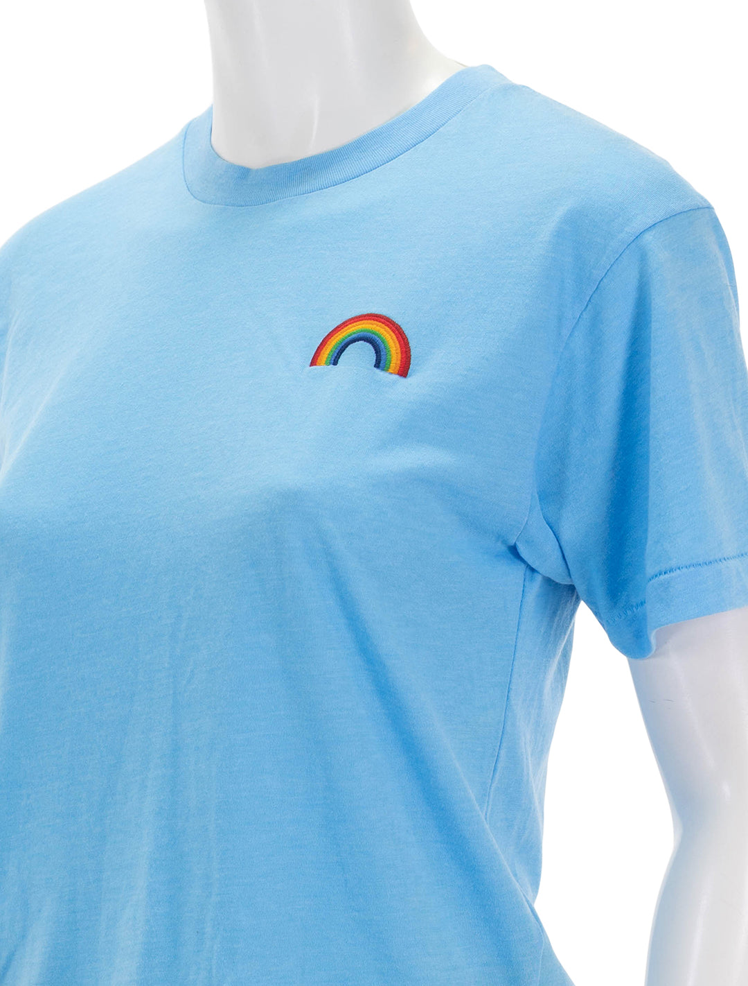 Close-up view of Aviator Nation's rainbow embroidery boyfriend tee in sky.