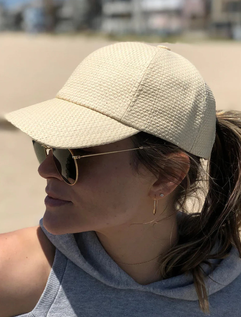 Model wearing Hat Attack's beach cap in natural.
