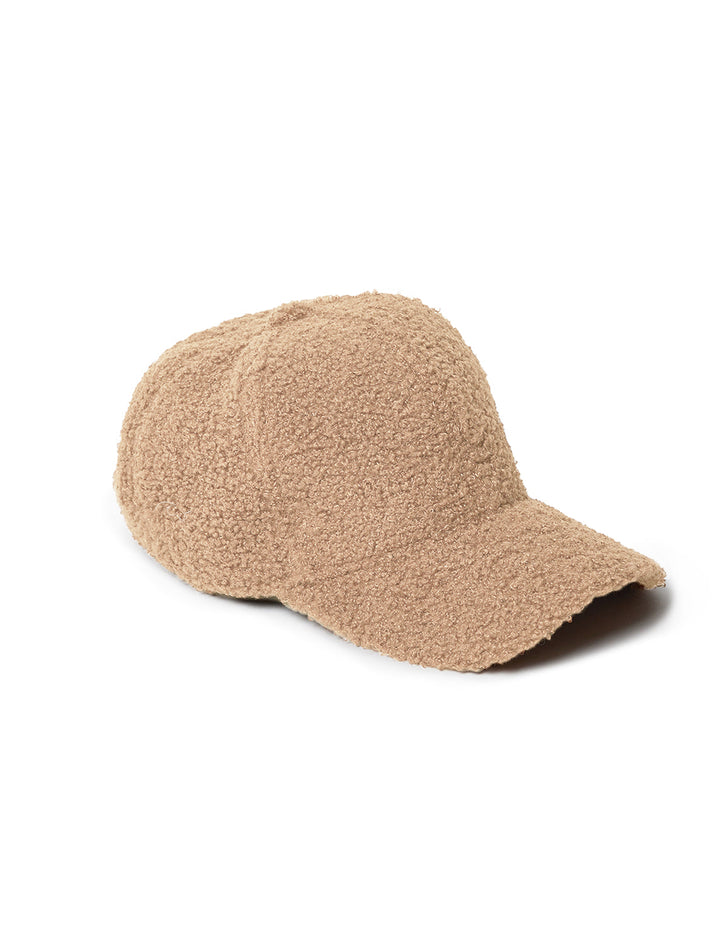 Front angle view of Hat Attack's sherpa cap in light tan.