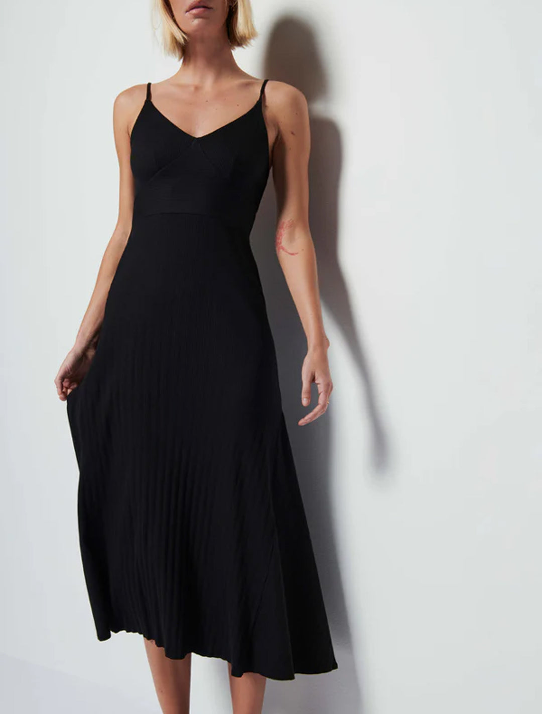 model wearing melanie rib tank dress in black